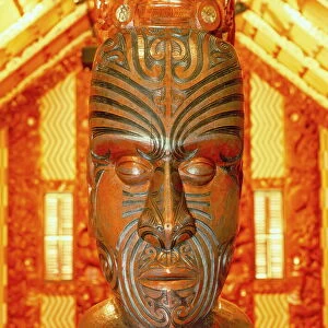 Maori statue with Moko facial tattoo