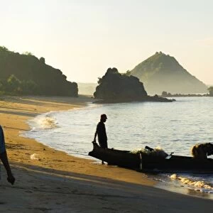 Panorama of a woman waiting for the fisherman to return at Kuta Beach, Kuta Lombok, Indonesia, Southeast Asia, Asia