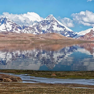 Pik Dankova peak reflecting in water, Tian Shan mountains at the Chinese border, Naryn province, Kyrgyzstan, Central Asia, Asia