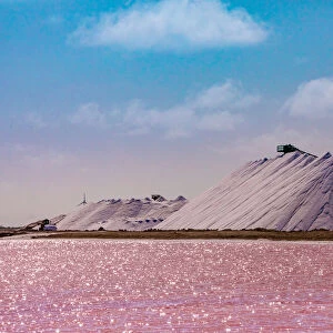 Pink colored ocean overlooking the Salt Pyramids of Bonaire, Netherlands Antilles