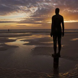 Another Place statues by artist Antony Gormley on Crosby beach, Merseyside