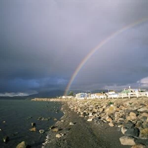 Rainbow over the town of Puerto Natales, Chile, South America