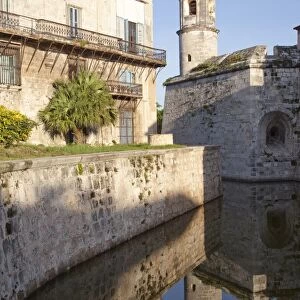 Reflection in moat of the tower of the Fortress of Real Fuerza in Old Havana