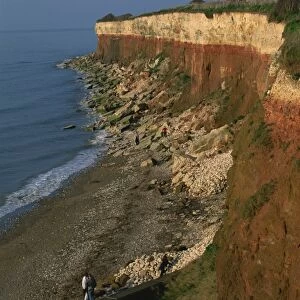 Rockfalls from red and white chalk cliff, Hunstanton, Norfolk, England