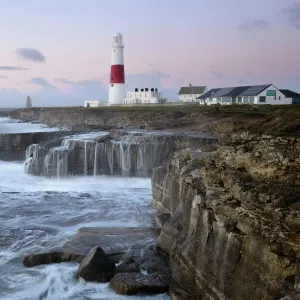 Rough seas crash over rocks near Portland Bill Lighthouse, Dorset, England, United Kingdom