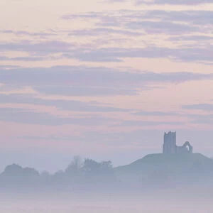 The ruined church of St. Michael on Burrow Mump, rising above the Somerset Levels at dawn on a frosty, misty morning, Burrowbridge, Somerset, England, United Kingdom, Europe