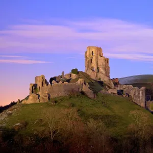 The ruins of the 11th century Corfe Castle after sunset, near Wareham, Isle of Purbeck