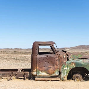 A rusty abandoned car in the desert near Aus in southern Namibia, Africa
