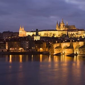 St. Vitus Cathedral, Charles Bridge and the Castle District illuminated at night in winter