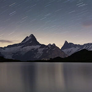 Star trail in the night sky over Bachalpsee lake, Grindelwald, Bernese Oberland