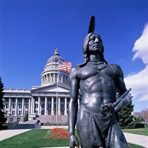 Statue of Native American in front of State Capitol