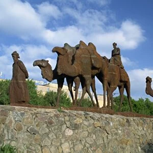 Statues of camels and camel drivers on Silk Road monument