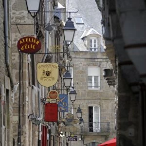 Street of lantern lights and traditional signs, Dinan, Cotes d Armor