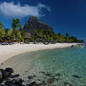 Sun loungers on the beach and Mont Brabant (Le Morne Brabant), UNESCO World Heritage Site