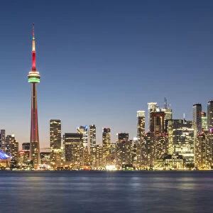Toronto skyline featuring the CN Tower at night across Lake Ontario, Toronto, Ontario, Canada, North America