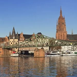 View over Main River to Eiserner Steg iron footbridge and Kaiserdom Cathedral of St