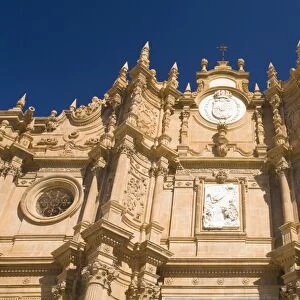 View from below of richly decorated facade of the cathedral, Guadix, Granada