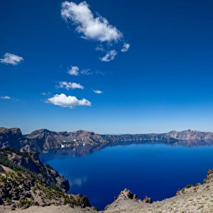 The still waters of Crater Lake, the deepest lake in the U. S. A. part of the Cascade Range
