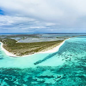White sand of 11 Mile Beach set among a tropical lagoon and Caribbean Sea, aerial view, Barbuda, Antigua and Barbuda, West Indies, Caribbean, Central America