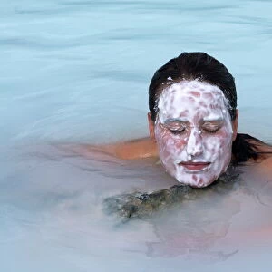 Woman enjoying the healing water of the blue lagoon, Reykjavik, Iceland, Polar Regions