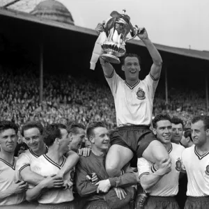 Bolton Wanderers captain Nat Lofthouse is chaired by his teammates after victory in the 1958 FA Cup Final