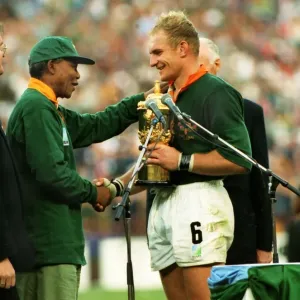 Francois Pienaar receives the Webb Ellis Cup Print Francois Pienaar receives the Webb Ellis Cup Print