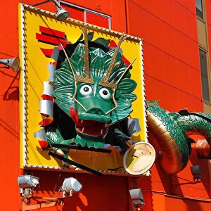 Giant green dragon advertising sign in Dotonbori, Osaka, Japan