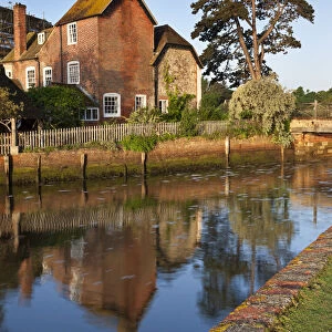 The 16th Century Mill House beside Beaulieu River, New Forest, Hampshire, England. Spring