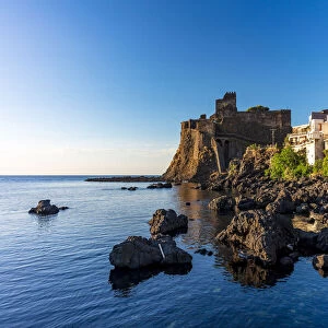 Aci Castello, Sicily. Norman castle on the sea in the morning