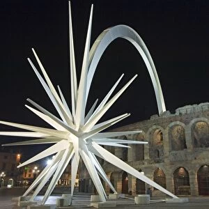 Amphitheatre and shooting star monument at night