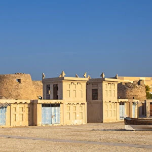 Bahrain, Manama, Arad Fort and traditional buildings with wind towers