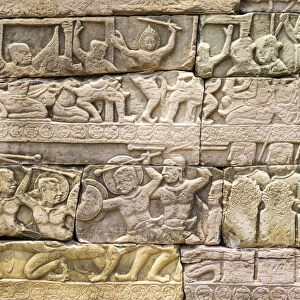 Bas-relief stone carvings depicting battle, Banteay Chhmar, Ankorian-era temple ruins