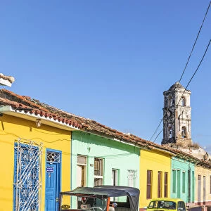 A classic car driving in a street in Trinidad, Sancti Spiritus, Cuba