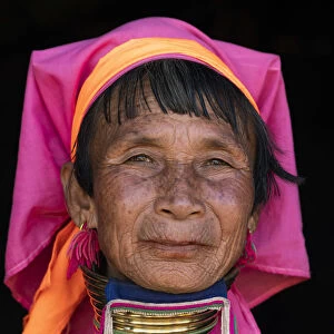 Close-up portrait of senior Kayan woman wearing traditional brass neck rings
