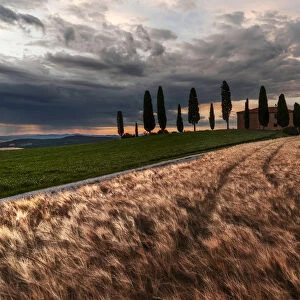 Countryhouse near Pienza during a cloudy sunset in summer, Val d Orcia, Tuscany