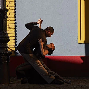 A couple of Professional Tango dancers in the colorful "Caminito de la Boca", Buenos Aires, Argentina. (MR)
