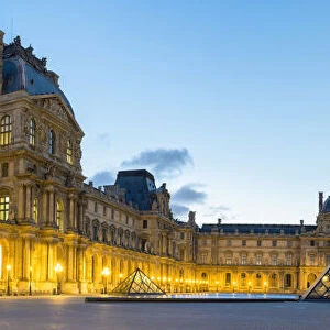 Courtyard and glass pyramid of the Louvre Museum at sunrise, Paris, Ile-de-France