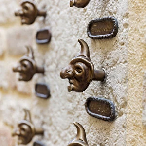 Doorbells shaped like masks, Venice, Veneto, Italy