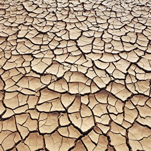 Dried out water hole in desert - Algeria, Tassili Hoggar, Tagrera - Sahara