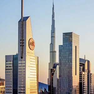 Dubai International Financial Centre and Burj Khalifa at sunset, elevated view, Dubai