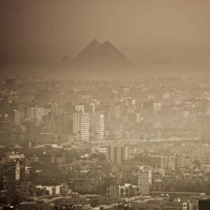 Egypt, Cairo, city skyline and pyramids in the distance, viewed from Cairo Tower