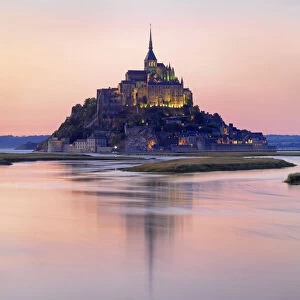 France, Normandy, Le Mont Saint Michel reflected in river at night