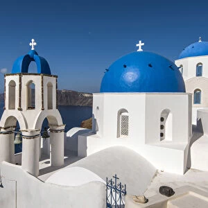 Greek orthodox church with blue domes in Oia, Santorini, South Aegean, Greece