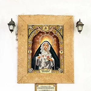 Image of Maria Santisima de los Desamparados (Virgin of the Helpless) on a building facade in Cadiz, Andalusia, Spain