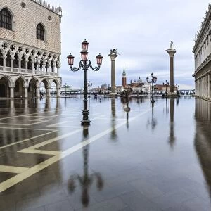 Italy, Veneto, Venice. High water on San Marco Square with Palazzo Ducale on the left