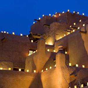 Lanterns lighting adobe building, Santa Fe, New Mexico, USA