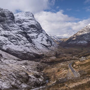 Looking down the pass of Glencoe with snow over the Three Sisters of Glencoe, Highland