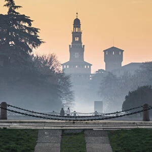Milan, Lombardy, Italy. The Castello Sforzesco during a foggy morning