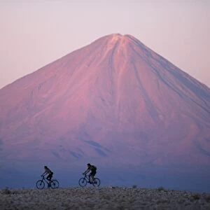 Mountain biking in the Atacama Desert against a backdrop