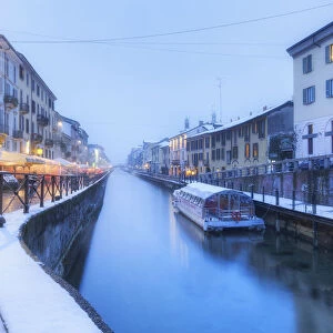 Naviglio Grande after a snowfall during dusk. Milan, Lombardy, Northern Italy, Italy